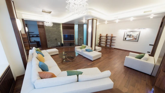 The,spacious,,well,lit,living,room,with,a,round,glass — Litomatic LED lighting
